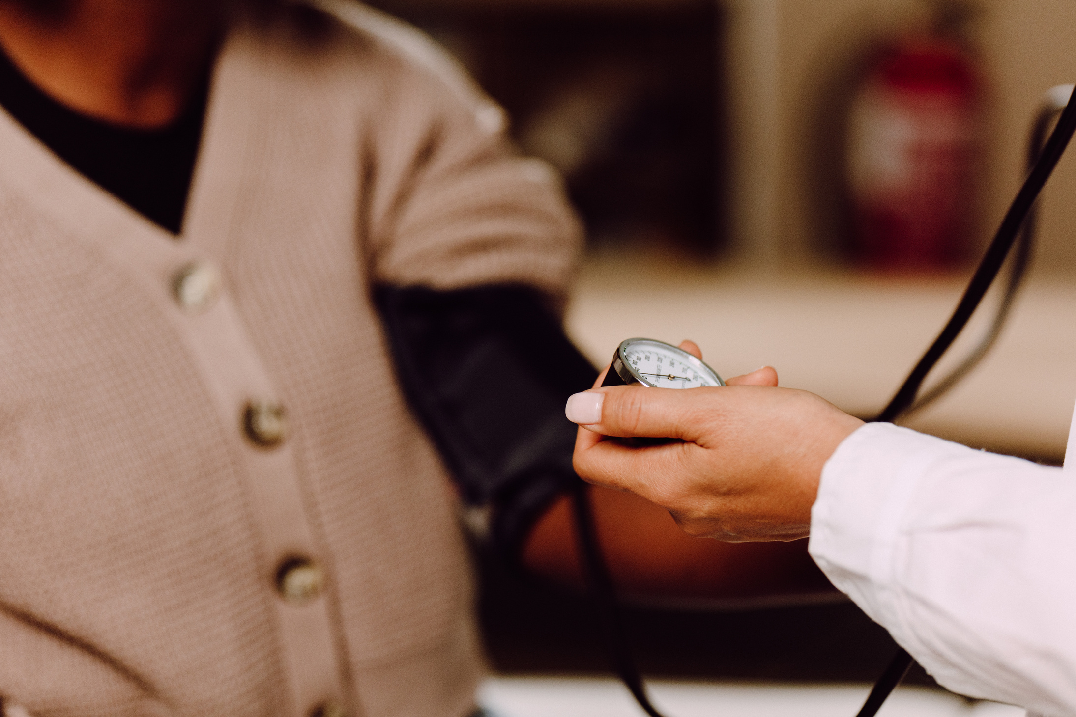 Doctor Using a Sphygmomanometer to a Patient